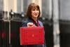 Rachel Reeves hold the red case to announce the budget