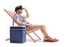 Man with a VR headset sitting in a deck chair